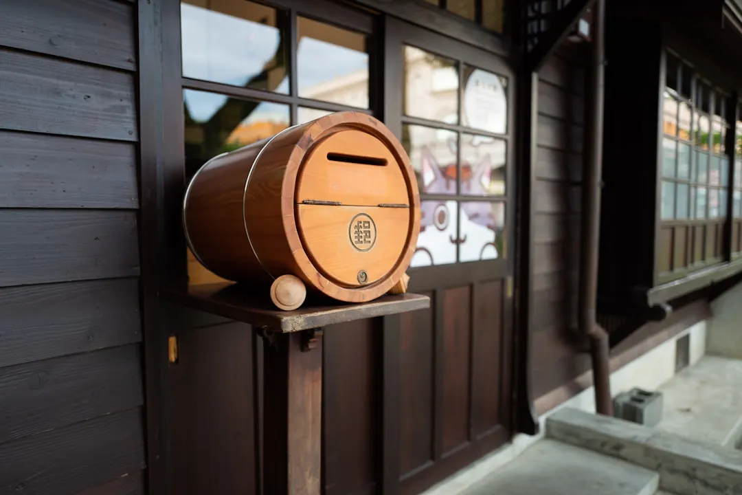 Rustic barrel room with oak casks stacked along the wall